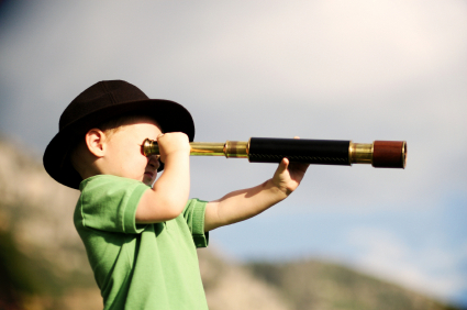 Small boy with telescope